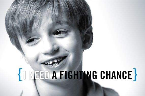 still from a a video of a boy in black and white saying I need a fighting chance