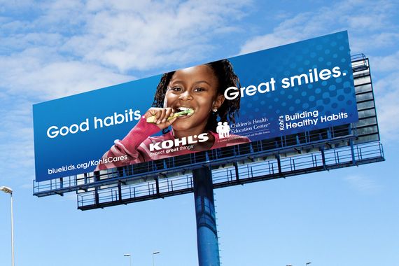 billboard of a girl brushing her teeth