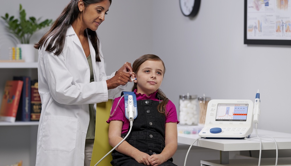 Natus Zodiac product being used on little girl by doctor